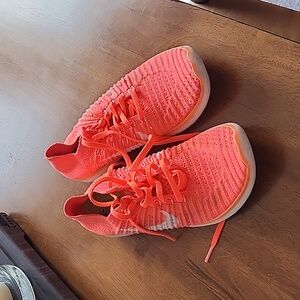 Nike free fly knit running shoes.